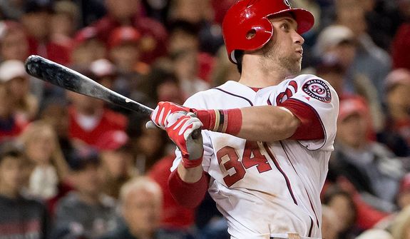 Washington Nationals center fielder Bryce Harper (34) hits a solo home run in the bottom of the third inning to put the Washington Nationals up 4-0 over the St. Louis Cardinals in game five of the National League Division Series at Nationals Park, Washington, D.C., Friday, October 12, 2012. (Andrew Harnik/The Washington Times)
