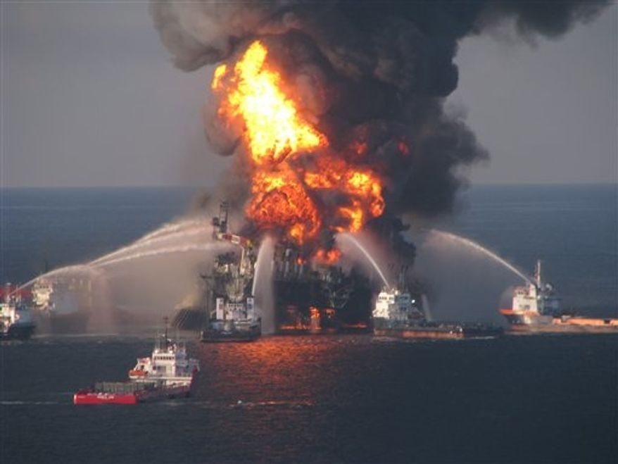 ** FILE ** In this April 21, 2010, file image provided by the U.S. Coast Guard, fire boat response crews battle the blazing remnants of the off shore oil rig Deepwater Horizon. (AP Photo/U.S. Coast Guard, File)