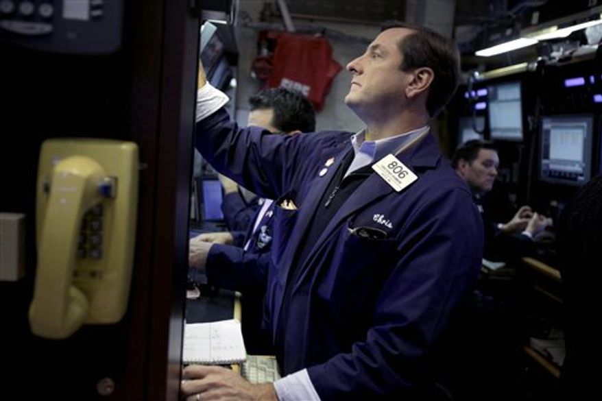 Traders work on the floor at the New York Stock Exchange, Thursday, Nov. 15, 2012. Stock indexes are inching higher in early trading Thursday after U.S. retail giants Wal-Mart and Target turned in mixed earnings reports. (AP Photo/Seth Wenig)