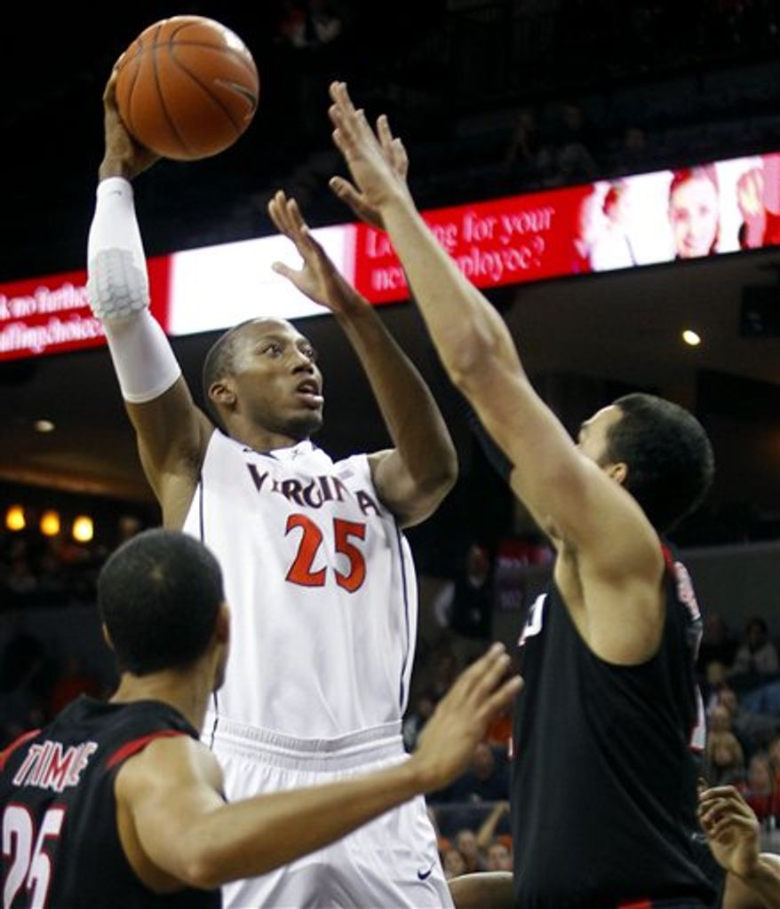 Virginia's Akil Mitchell (25) shoots over Seattle's David Trimble(25) and Clarence Trent (12) during an NCCA college basketball game on Saturday, Nov. 17, 2012, in Charlottesville, Va. (AP Photo/The Daily Progress, Andrew Shurtleff)