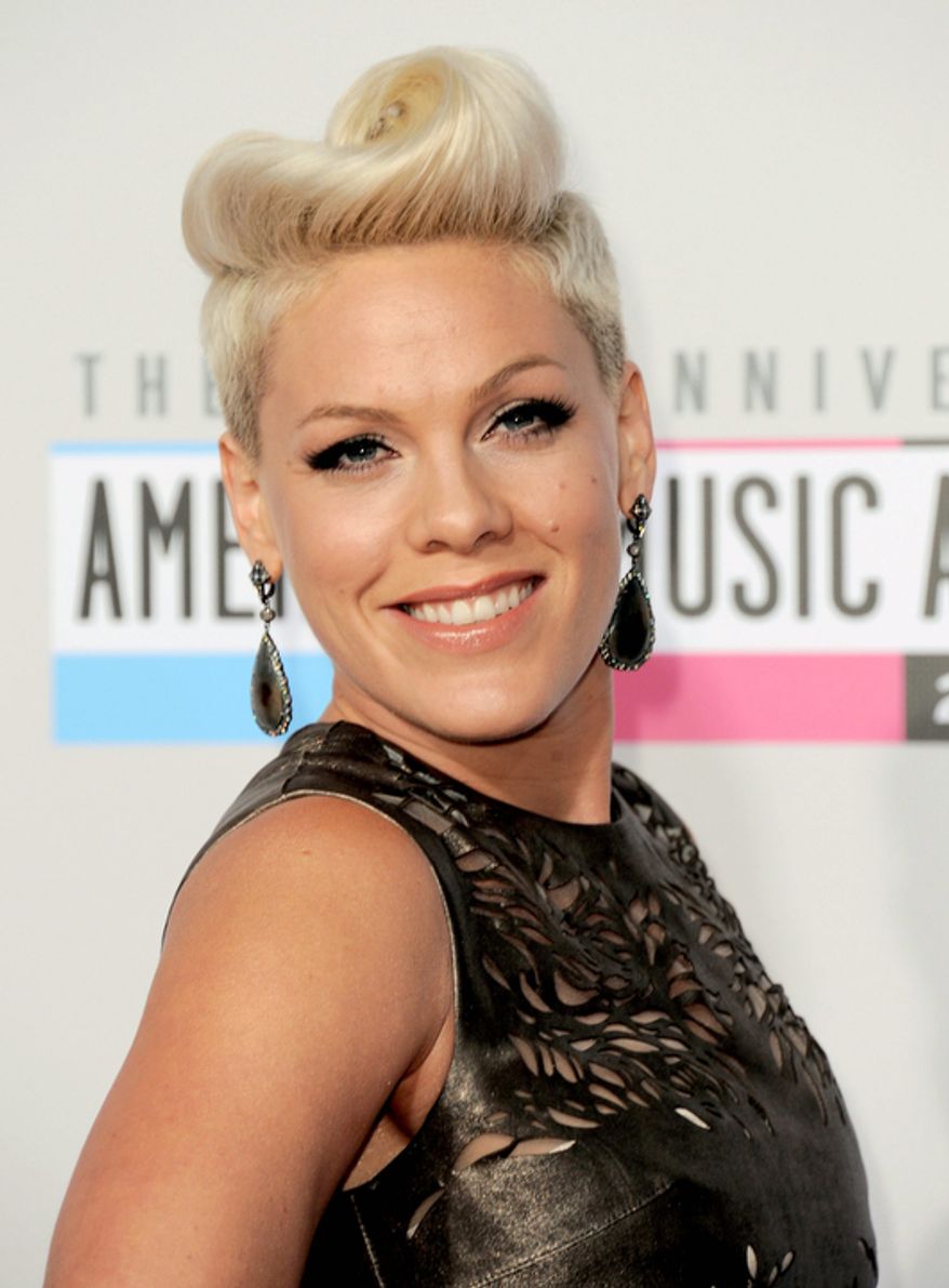 Pink arrives at the 40th Anniversary American Music Awards on Sunday, Nov. 18, 2012, in Los Angeles. (Photo by Jordan Strauss/Invision/AP)