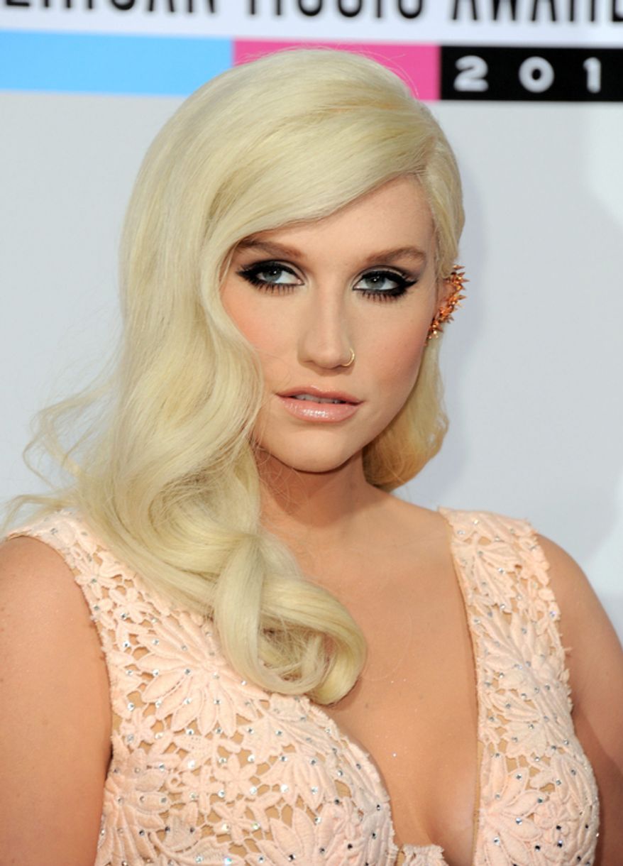 Ke$ha arrives at the 40th Anniversary American Music Awards on Sunday, Nov. 18, 2012, in Los Angeles. (Photo by Jordan Strauss/Invision/AP)