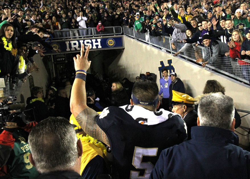 Notre Dame senior lineback Manti Te'o walks into the tunnel at Notre Dame stadium after a 38-0 win over Wake Forest Saturday Nov. 17, 2012 in South Bend, Ind. As a senior, it was Te'o's final home game. (AP Photo/The Goshen News, Sam Householder)