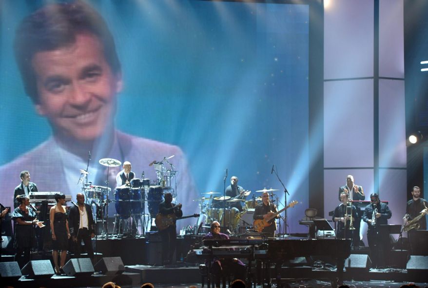 Stevie Wonder and the Rickey Minor Band perform "Master Blaster," "My Cherie Amour" and "Sir Duke" during a tribute to Dick Clark at the 40th Anniversary American Music Awards in Los Angeles on Nov. 18, 2012. (John Shearer/Invision/Associated Press)