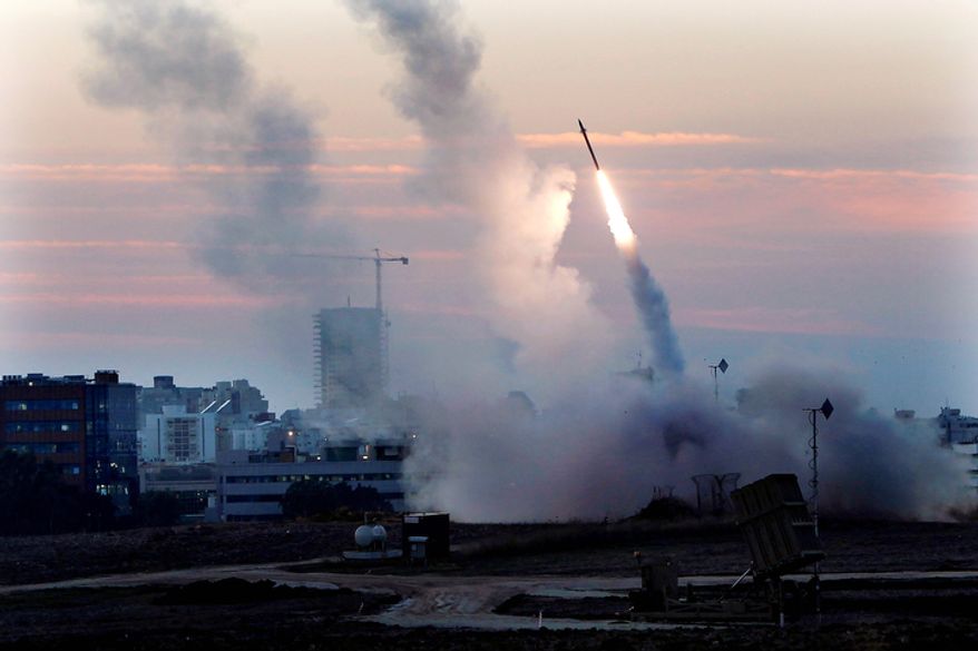 **FILE** The Iron Dome defense system fires to intercept incoming missiles from Gaza in the port town of Ashdod on Nov. 15, 2012. (Associated Press)