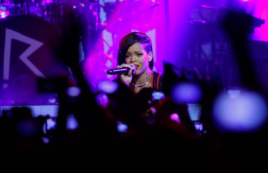 Barbadian singer Rihanna performs during the first stop of her "777" worldwide tour at the Plaza Condesa in Mexico City on Nov. 14, 2012. (Associated Press)