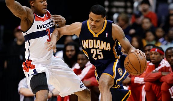 Washington Wizards forward Trevor Ariza guards Indiana Pacers forward Gerald Green during the first half of the Pacers' 96-89 road win on Nov. 19, 2012. (Associated Press)