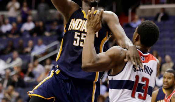 Indiana Pacers center Roy Hibbert shoots over Washington Wizards forward Kevin Seraphin during the second half of the Pacers' 96-89 road win on Nov. 19, 2012. (Associated Press)