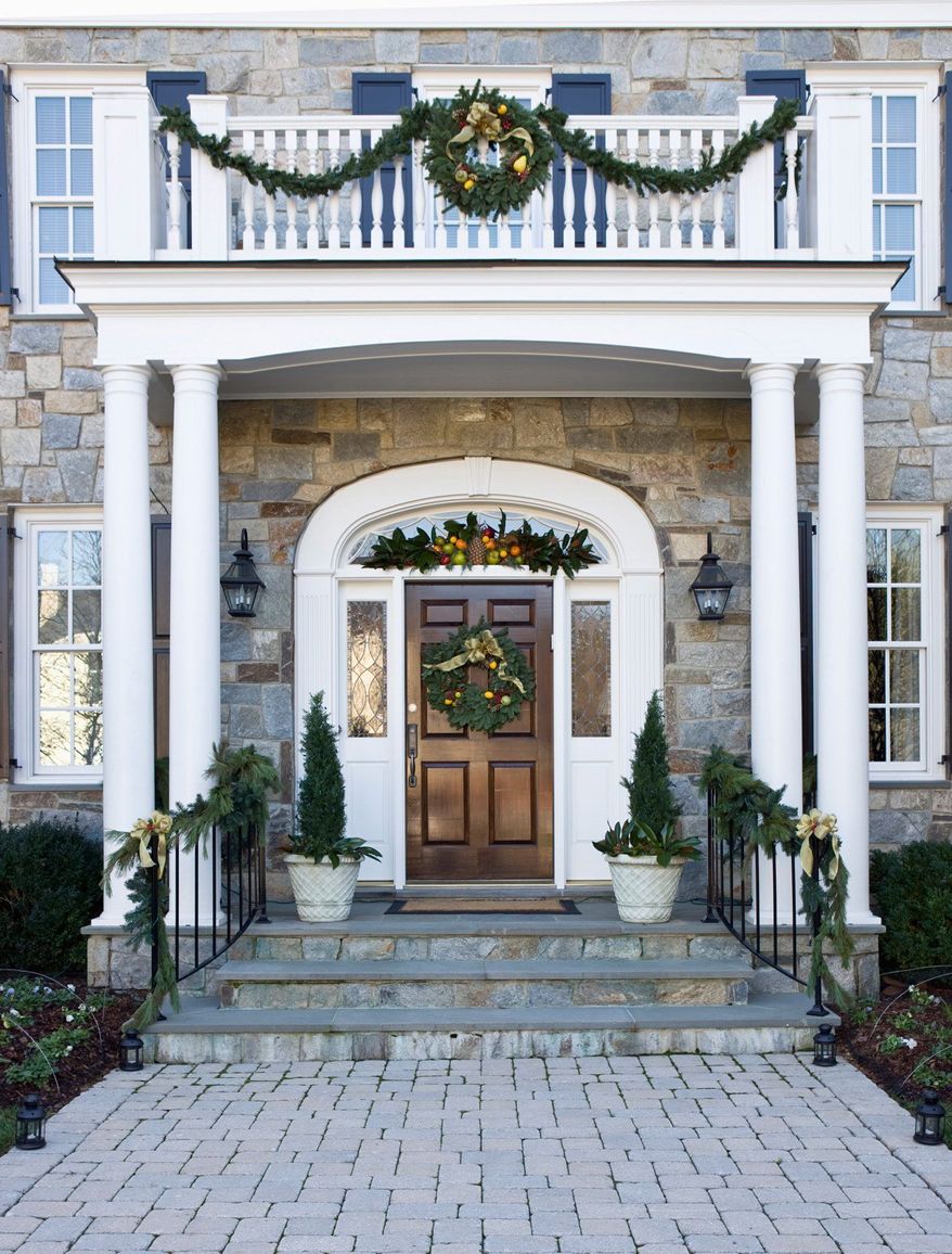 Photograph provided by Angie Seckinger
Interior designer Shanon Munn suggests pulling your holiday decorations together by using one fabric in multiple places, starting with the bow on your front-door wreath.