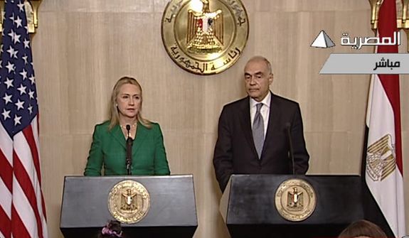 In this image made from Egyptian State Television, U.S. Secretary of State Hillary Rodham Clinton, left, and Egyptian Foreign Minister Mohammed Kamel Amr, right, give a joint news conference announcing a cease-fire between Israel and Hamas in Cairo, Egypt, Wednesday, Nov. 21, 2012. Egypt has announced a cease-fire agreement to end a week of fighting between Israel and Hamas militants in the Gaza Strip. Foreign Minister Mohammed Kamel Amr said the truce would take effect at 9 p.m. local time (2 p.m. EDT.) He made the announcement alongside visiting U.S. Secretary of State Hillary Rodham Clinton. (AP Photo/Egyptian State Television)