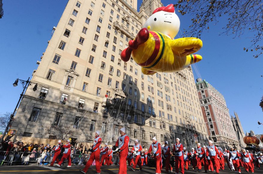The Hello Kitty Balloon makes it's way down New York's Central Park West in the 86th annual Macy's Thanksgiving Day Parade,Thursday, Nov 22, 2012. (AP Photo/ Louis Lanzano)