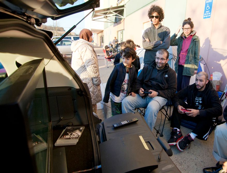 Shoppers wait in line to be let into Best Buy on Thanksgiving Day, Springfield, Va., Thursday, November 22, 2012. (Craig Bisacre/The Washington Times)