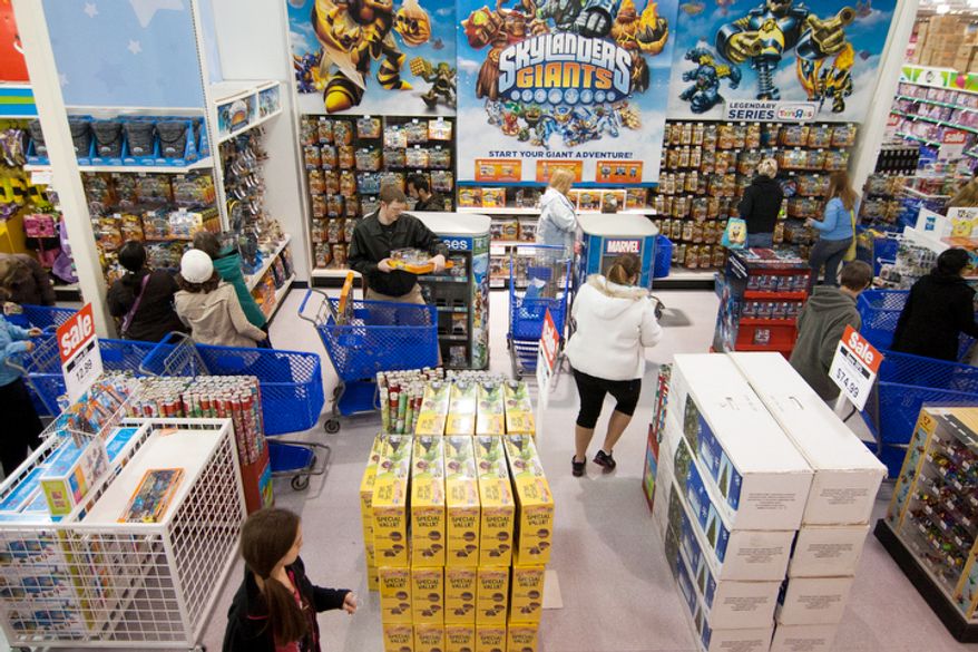 Shoppers look for bargains at Toys'R'Us on Thanksgiving Day, Fairfax, Va., Thursday, November 22, 2012. The stores, which opened nationwide at 8PM, will remain open for 24 hours for Black Friday. (Craig Bisacre/The Washington Times)