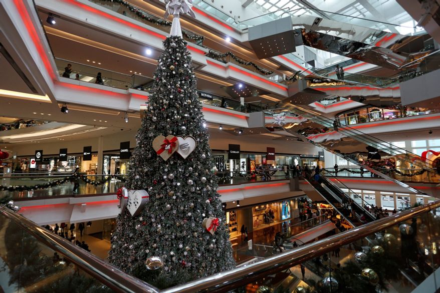 A Christmas tree is displayed at a shopping mall in Hong Kong as the city prepares to celebrate the Christmas holidays on Monday, Nov. 26, 2012. (AP Photo/Vincent Yu)