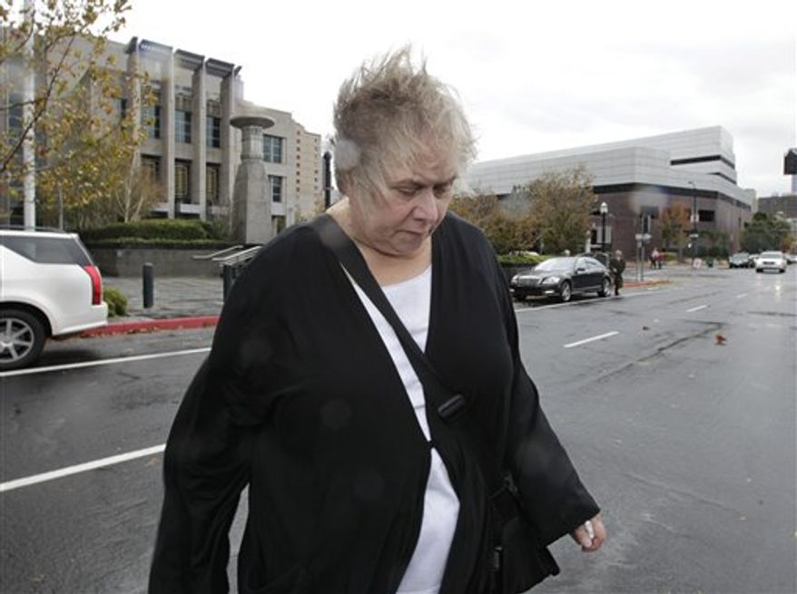 Former Democratic campaign treasurer Kinde Durkee leaves the federal courthouse in Sacramento, Calif., after she was sentenced to more than eight years in federal prison for defrauding high-profile clients, such as U.S. Sen. Dianne Feinstein, Wednesday, Nov. 28, 2012. Durkee, who pleaded guilty to five counts of mail fraud in March, was sentenced to a total of 97 months and was ordered to pay $10.5 million in restitution for tampering with the electoral process. (AP Photo/Rich Pedroncelli)