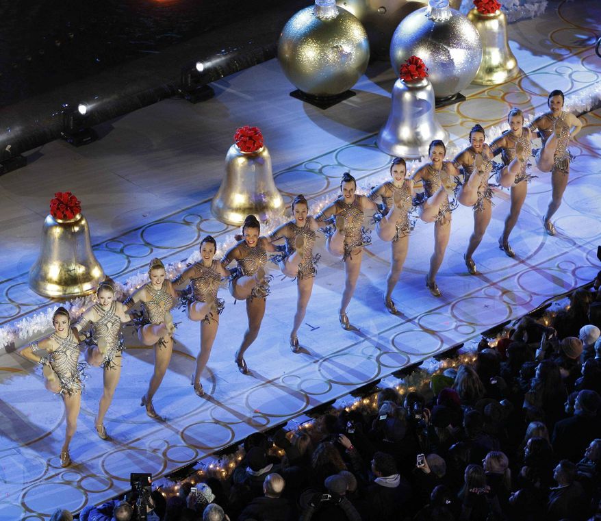 The Radio City Music Hall Rockettes perform before the Rockefeller Center Christmas Tree is lit during the 80th annual tree lighting ceremony at Rockefeller Center in New York, Wednesday, Nov. 28, 2012. (AP Photo/Kathy Willens)