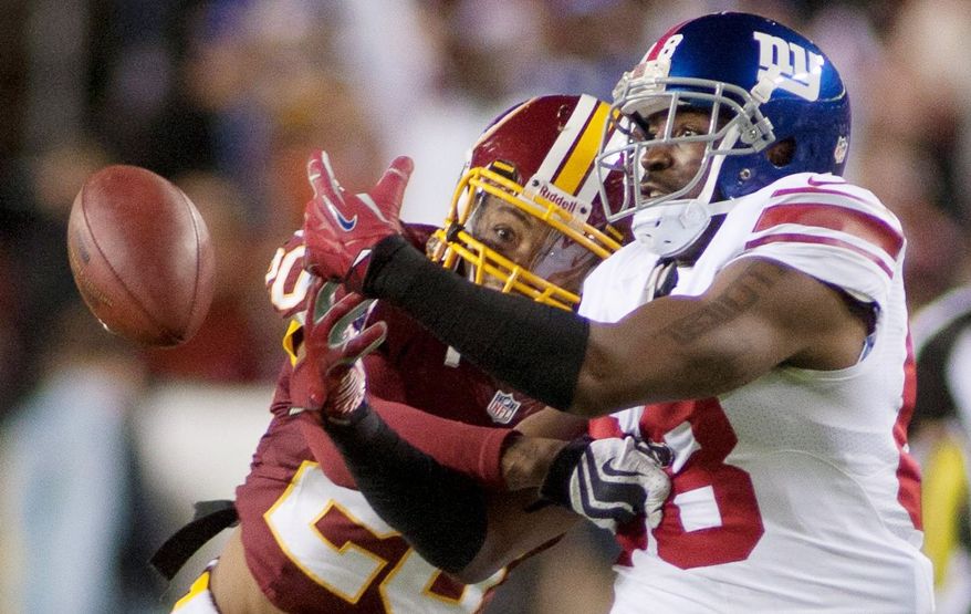 craig bisacre/the washington times
Redskins defensive back Cedric Griffin (left) has 33 tackles, four pass breakups and one forced fumble in nine games this season.