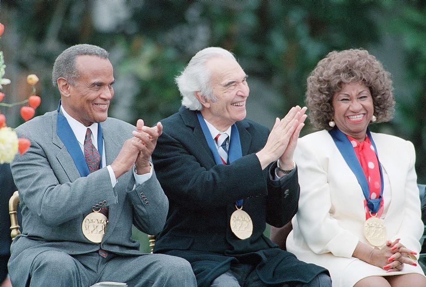 Actor-singer Harry Belafonte left, jazz musician and composer Dave Brubeck, center, and singer Celia Cruz, at the White House Friday, Oct. 14, 1994, Washington, DC. They received 1994 National Medals of Arts. (AP Photo/Joe Marquette)