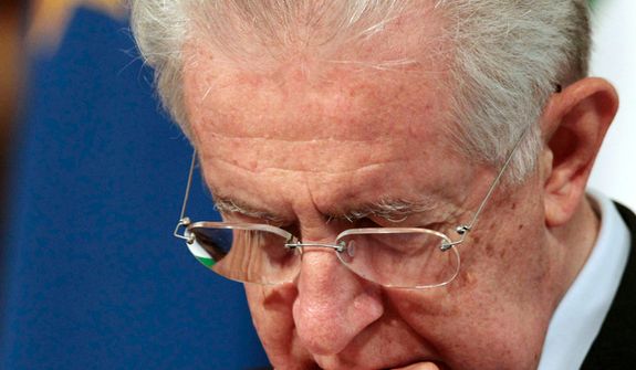 **FILE** Italian premier Mario Monti looks down Oct. 24, 2012, during a joint press conference with Austrian chancellor Werner Faymann at Chigi palace at the Premier's office in Rome on Oct. 24, 2012. (Associated Press)