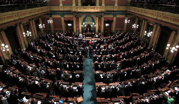 Michigan Gov. Rick Snyder delivers his State of the State address to a joint session of the House and Senate in Lansing, Mich., Wednesday, Jan. 18, 2012. (AP Photo/Carlos Osorio)