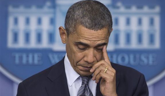 President Obama wipes his eye as he talks in the White House briefing room in Washington about the Connecticut elementary school shooting on Dec. 14, 2012. (Associated Press)