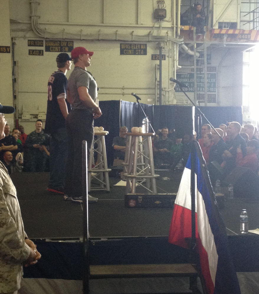 Capitals forward Matt Hendricks and Nationals pitcher Ross Detwiler on stage for a USO show on the USS John C. Stennis. (Photo courtesy Matt Hendricks)