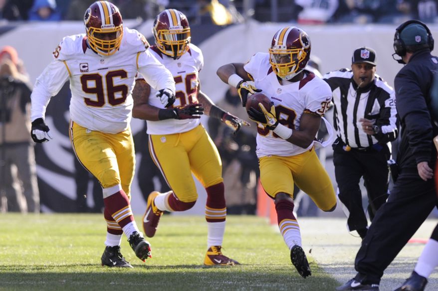 Washington Redskins cornerback Richard Crawford (39) recovers an Eagles fumble in the second quarter at Lincoln Financial Field, Philadelphia, Pa., Dec. 23, 2012. (Preston Keres/Special to The Washington Times)