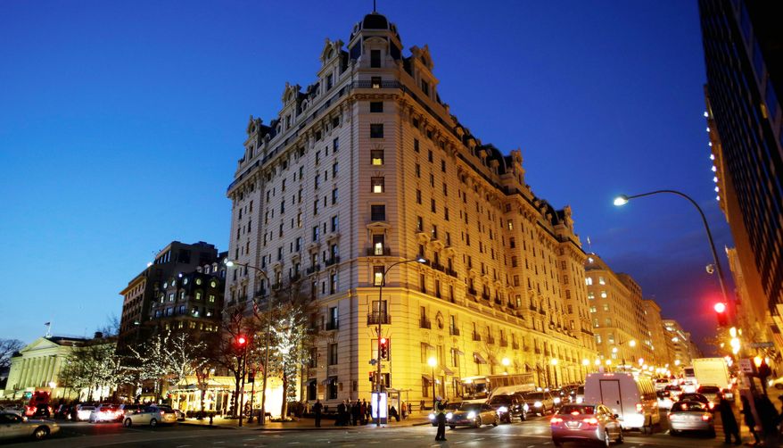 ** FILE ** In this Dec. 19, 2012, file photo, the Willard Hotel is seen at dusk in Washington. At the Willard, about a block from the White House, rooms are still available for the presidential inauguration starting at more than $1,100 a night with a four-night minimum. That means every guest will pay more than President Abraham Lincoln did when he checked out after his 1861 inauguration and paid $773.75 for a stay of more than a week. (AP Photo/Jacquelyn Martin)