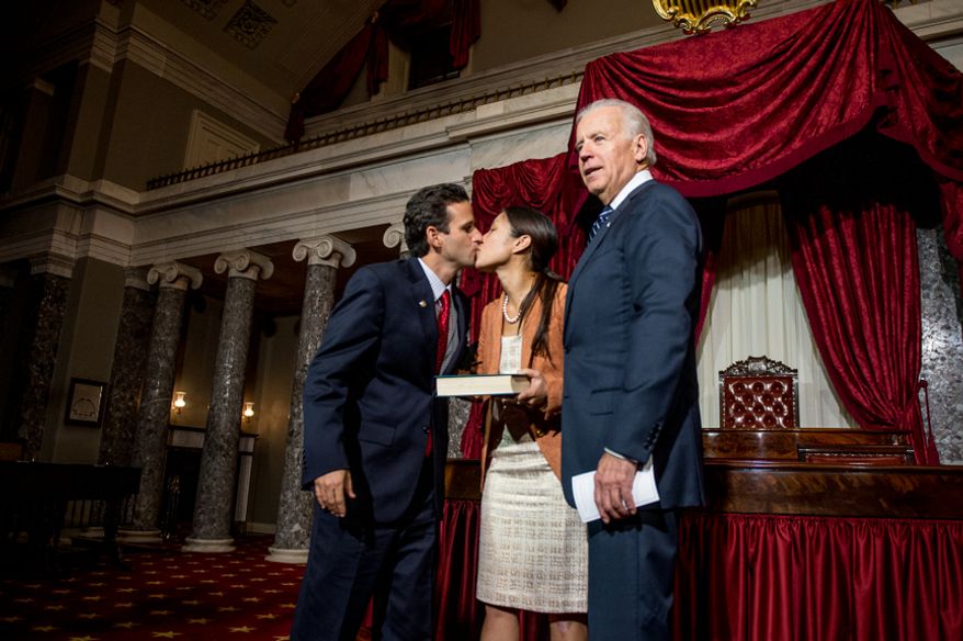 Brian Emanuel Schatz (D-Hawaii), kisses his wife, Linda, after re-enacting his swearing-in ceremony with Vice President Joe Biden inside the old Senate Chamber at the U.S. Capitol Building, Washington, D.C., Thursday, Dec. 27, 2012. Schatz, who was the Lieutenant Governor for Hawaii was selected by Hawaii Gov. Neil Abercrombie to the U.S. Senate seat left vacant by the late Daniel K. Inouye. (Andrew Harnik/The Washington Times)