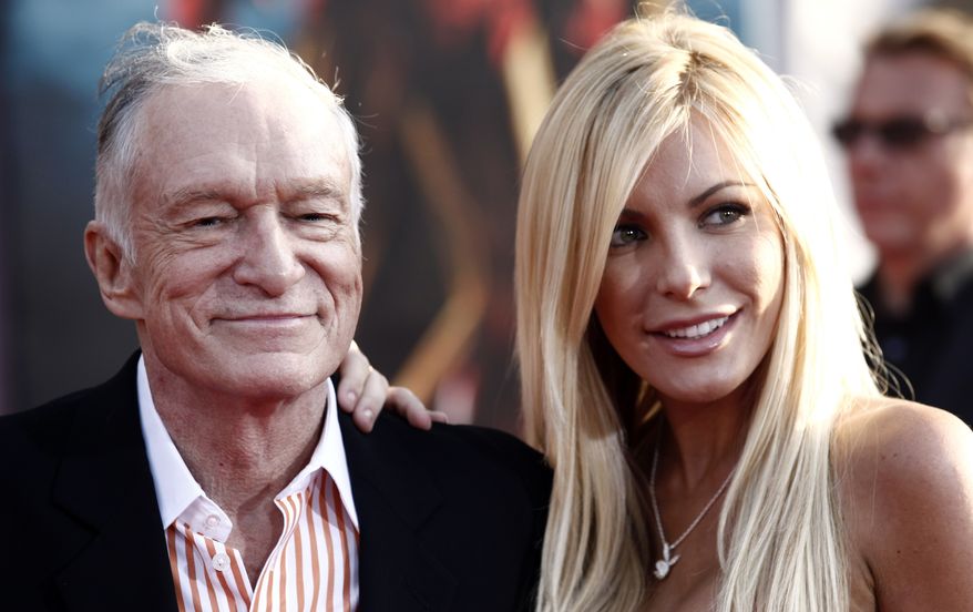 Hugh Hefner, founder of Playboy magazine, and Crystal Harris, one of the publication's Playmates of the Month in 2009, arrive at the premiere of "Iron Man 2" at the El Capitan Theatre in Los Angeles in 2010. (AP Photo/Matt Sayles)