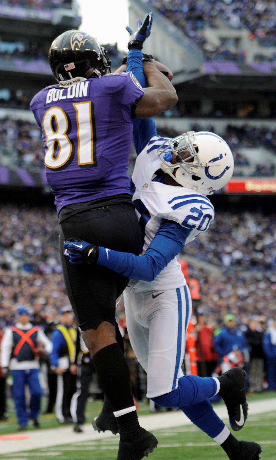 Ravens wide receiver Anquan Boldin catches a touchdown pass while being defended by Colts cornerback Darius Butler on Sunday during the second half. Boldin finished with five catches for 145 yards. (Associated Press)