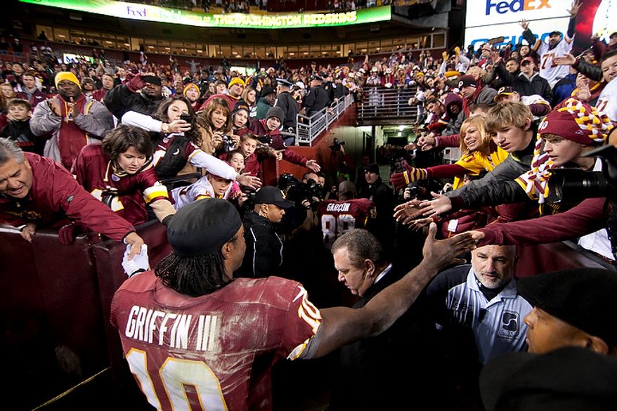 Washington Redskins quarterback Robert Griffin III (10) leaves the field after losing 24 to 14 against the Seattle Seahawks in the NFC wild card game at FedEx Field, Landover, Md., Sunday, January 6, 2013. (Craig Bisacre/The Washington Times)