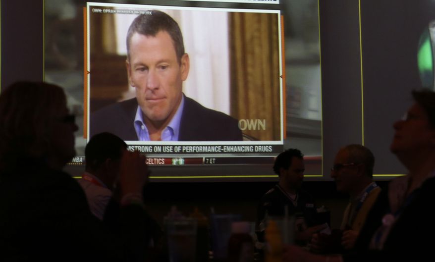 A video screen at a hotel restaurant in Grapevine, Texas, Friday, Jan. 18, 2013, shows a replay telecast of a segment of Lance Armstrong being interviewed by Oprah Winfrey. The second part of the interview airs on Friday night. (AP Photo/LM Otero)