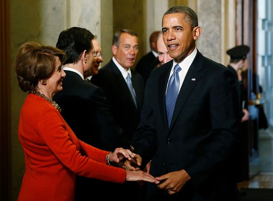 U.S. President Barack Obama (R) greets House Minority Leader Nancy Pelosi (D-CA) (L) as he arrives at the senate carriage entrance for swearing-in ceremonies at the U.S Capitol in Washington, January 21, 2013. REUTERS/Jonathan Ernst