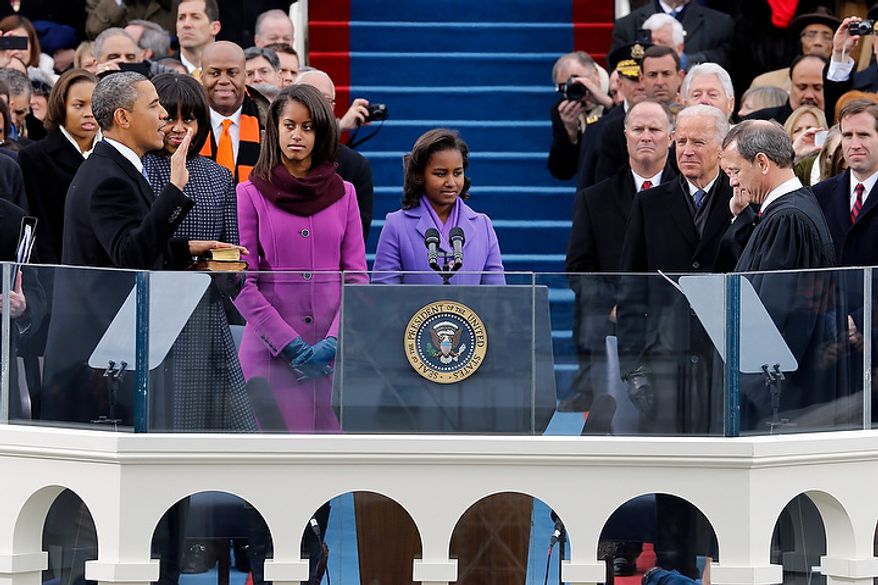 President Barack Obama takes the oath of office from Chief Justice John Roberts at the ceremonial swearing-in at the U.S. Capitol during the 57th Presidential Inauguration in Washington, Monday, Jan. 21, 2013. (AP Photo/Scott Andrews, Pool)