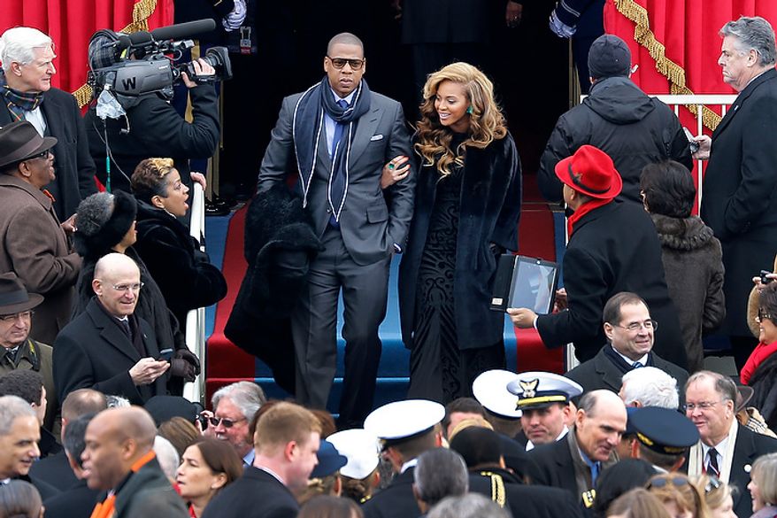 Beyonce and Jay-Z arrive at the ceremonial swearing-in for President Barack Obama at the U.S. Capitol during the 57th Presidential Inauguration in Washington, Monday, Jan. 21, 2013. (AP Photo/Scott Andrews, Pool)