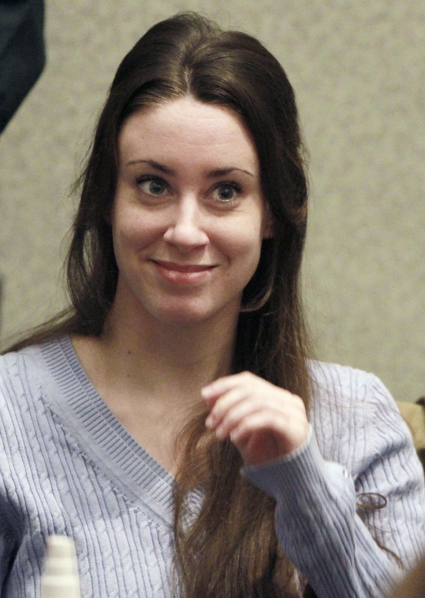 ** FILE ** Casey Anthony smiles before the start of her sentencing hearing in Orlando, Fla., on July 7, 2011. (Associated Press)