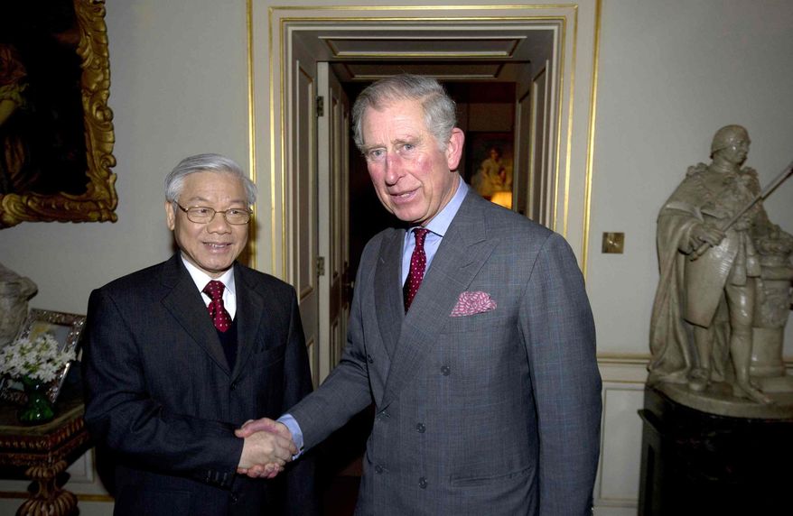 Britain's Prince Charles, the Prince of Wales, greets Vietnamese General Secretary of the Communist Party Nguyen Phu Trong, left, at Clarence House in central London, Wednesday, Jan. 23, 2013. (AP Photo/Carl Court, Pool)