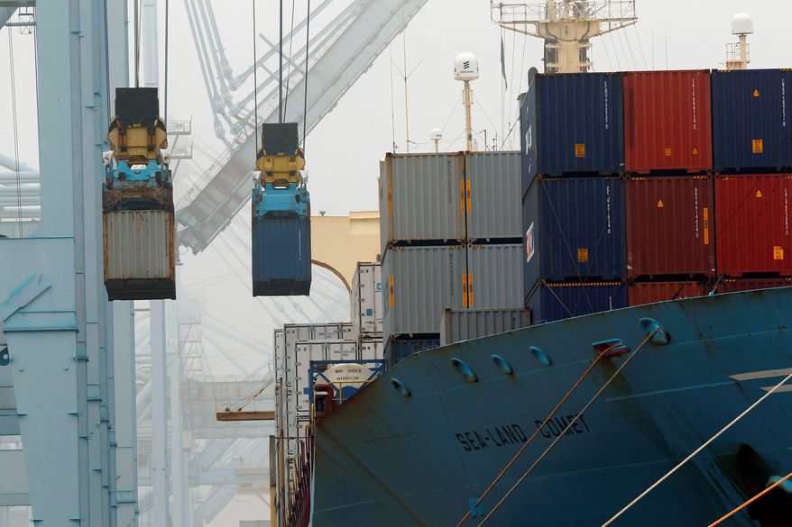 **FILE** Cargo ships are unloaded in December at the Port of Los Angeles. (Associated Press)