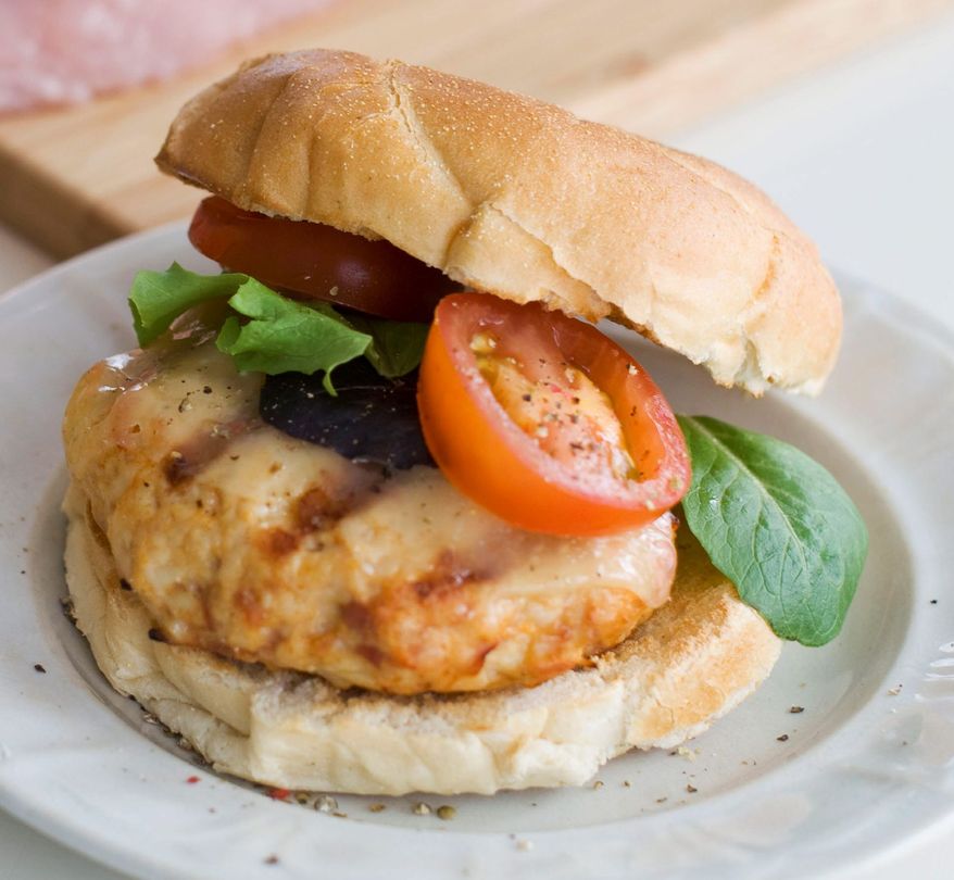 Chopped turkey tenderloin makes a lean and delicious burger, especially served with manchego. (Associated Press)