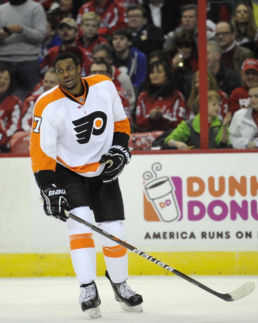 Philadelphia Flyers right wing Wayne Simmonds (17) leaves the ice after being injured against the Washington Capitals during the first period of an NHL hockey game on Friday, Feb. 1, 2013, in Washington. The Capitals won 3-2. (AP Photo/Nick Wass)
