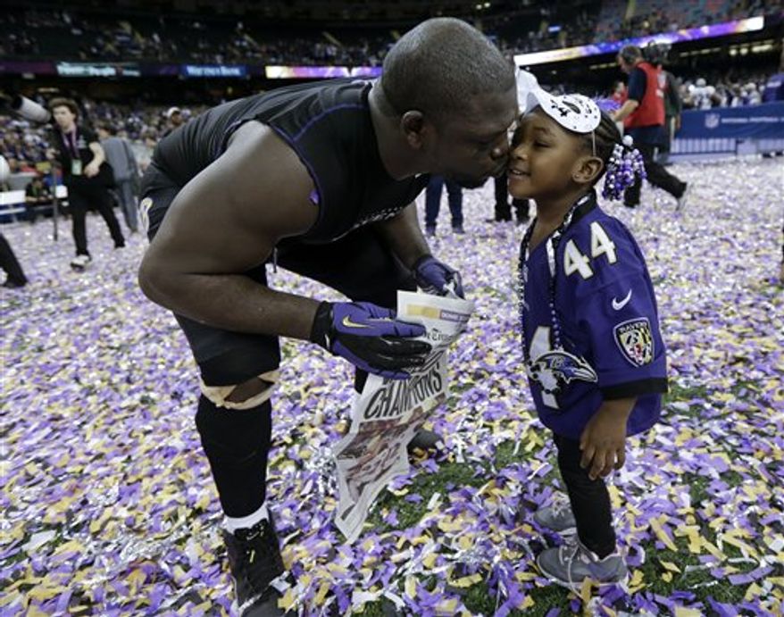 Baltimore Ravens fullback Vonta Leach celebrates with his daughter Giselle after their 34-31 win against the San Francisco 49ers in the NFL Super Bowl XLVII football game, Sunday, Feb. 3, 2013, in New Orleans. (AP Photo/Marcio Sanchez)