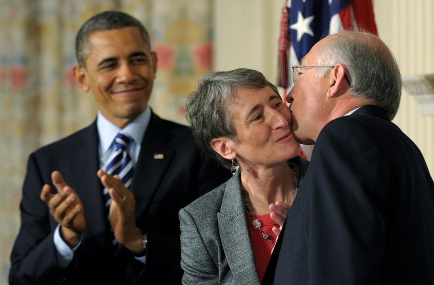 President Obama watches as his Interior Secretary nominee Sally Jewell, a former CEO of REI Inc., gets a kiss from outgoing Secretary Kenneth L. Salazar on Wednesday. The announcement was made in the White House State Dining Room. (Associated Press)