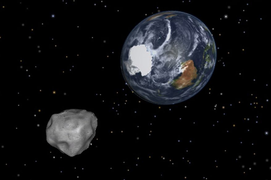 This image shows a simulation of asteroid 2012 DA14 approaching from the south as it passes through the Earth-moon system on Feb. 15, 2013. The 150-foot object passed within 17,000 miles of the Earth. (Associated Press/NASA/JPL-Caltech)