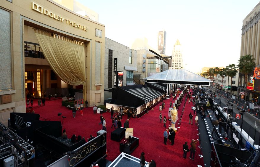 Workers prepare the red carpet for the 85th Academy Awards at the Dolby Theatre in Los Angeles on Saturday, Feb. 23, 2013. The Oscars will be presented on Sunday. (Matt Sayles/Invision/AP)