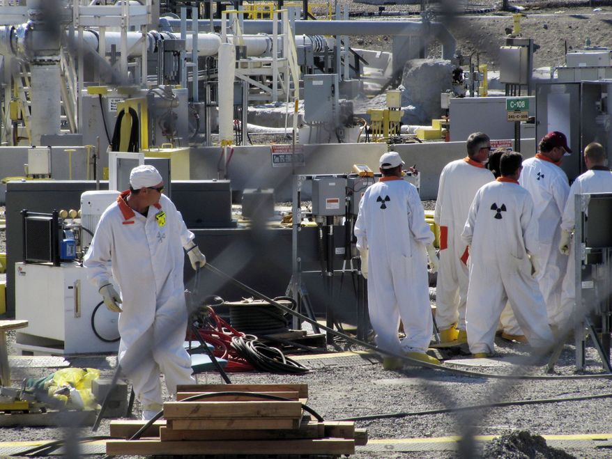 Workers at the Hanford Nuclear Reservation near Richland, Wash., are on duty at an underground tank farm where highly radioactive waste is stored on July 14, 2010. (AP Photo/Shannon Dininny)