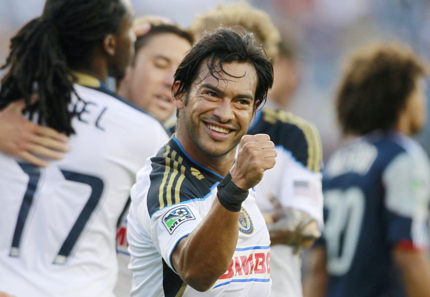 **FILE** Philadelphia Union's Carlos Ruiz celebrates his goal in the first half of an MLS soccer game against the New England Revolution in Foxborough, Mass., Sunday, July 17, 2011. The Union won 3-0. (AP Photo/Michael Dwyer)