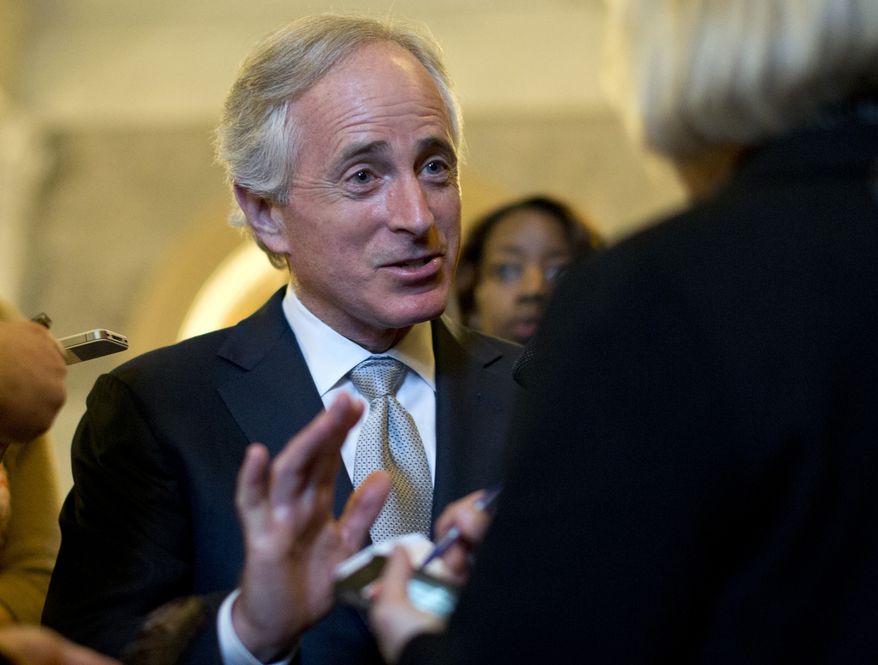 ** FILE ** Sen. Bob Corker, Tennessee Republican, talks with reporters on Capitol Hill on Feb. 26, 2013, after the weekly Republican policy luncheon. (Associated Press)