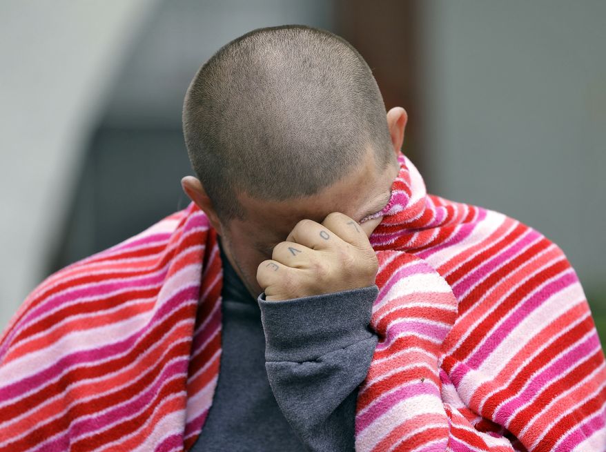 Jeremy Bush, brother of Jeff Bush, breaks down as he speaks to the media about attempting to rescue Jeff as he disappeared in a sinkhole Friday, March 1, 2013, in Seffner, Fla. (AP Photo/Chris O'Meara)