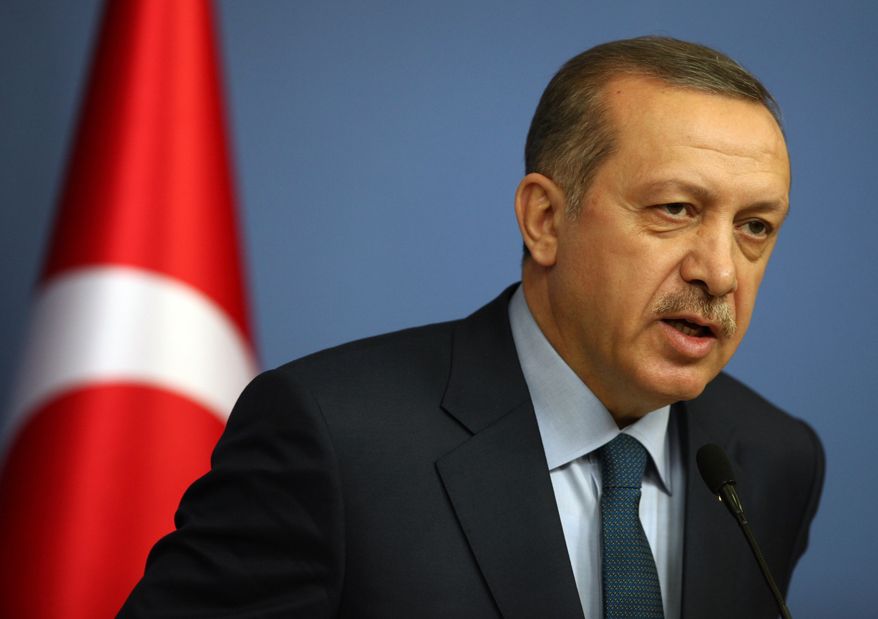 Turkish Prime Minister Recep Tayyip Erdogan speaks during a joint news conference with German Chancellor Angela Merkel, unseen, in Ankara, Turkey, Monday, Feb. 25, 2013. (AP Photo/Burhan Ozbilici)
